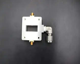 How can we accurately measure the power coupling efficiency and isolation between ports in a waveguide probe coupler?